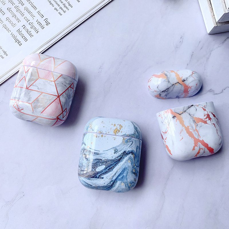 Luxury White Marble AirPods Case collection featuring geometric and marble designs in pink, blue, and orange tones.