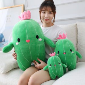 Three cactus plush toys in small, medium, and large sizes with pink flowers and smiling faces.